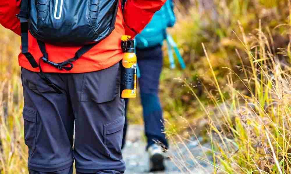 Hiker keeping a bear spray handy